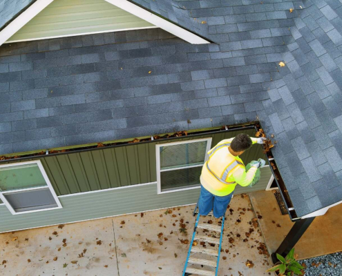 An illustration of a professional roofing contractor performing maintenance on a roof.