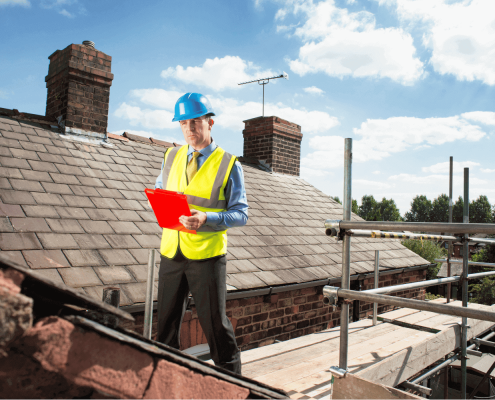 A professional roofer assessing a roof for potential shingle replacement