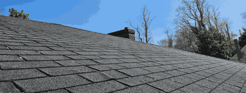 A comparison of asphalt shingles vs architectural shingles, showcasing their different styles.