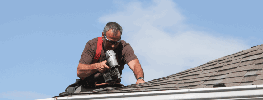 A professional roofer conducting a regular roof inspection.