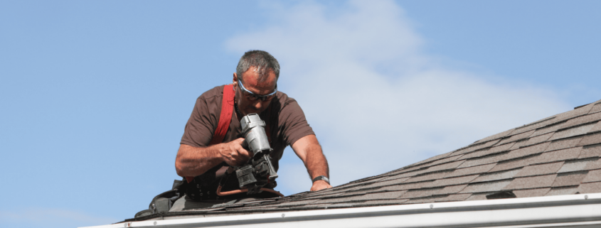 A professional roofer conducting a regular roof inspection.