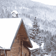 A roofing crew working on a roof replacement during winter conditions.