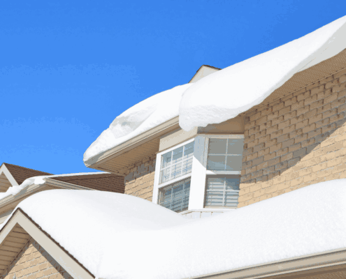 A winter roof showcasing a new installation with snow on top.