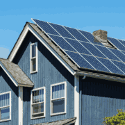 Solar shingles integrated into a roof, demonstrating energy efficiency.