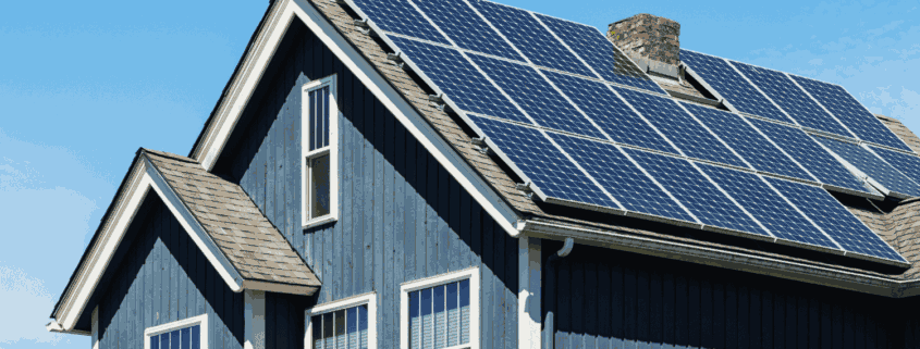 Solar shingles integrated into a roof, demonstrating energy efficiency.