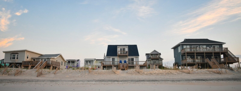 What Does It Take to Maintain a Rental at the Shore? 1 Row of raised beach rental cottages on an empty shore beach, Ocean City MD