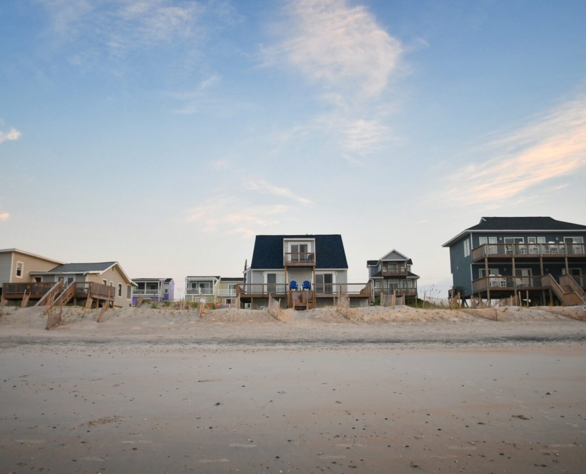 Row of raised beach rental cottages on an empty shore beach, Ocean City MD Row of raised beach rental cottages on an empty shore beach in the off-season