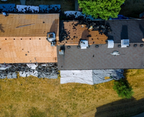 Wind Damage or Just an Old Roof? How to Tell What Took Your Shingles 4 Aerial view of an old asphalt shingle roof being stripped down to the decking, Ocean City MD