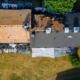 Aerial view of an old asphalt shingle roof being stripped down to the decking, Ocean City MD