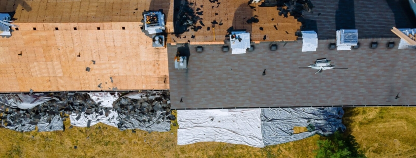Aerial view of an old asphalt shingle roof being stripped down to the decking, Ocean City MD
