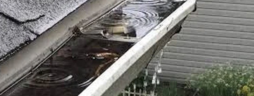 Why Do My Gutters Overflow Every Storm? 1 Gutter filled with rainwater overflowing over its edge during a storm